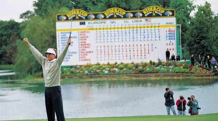 Davis Love III of the USA team celebrates on the 18th after defeating European Costantino Rocca during the 1993 Ryder Cup at the Belfry in Sutton Coldfield in England.